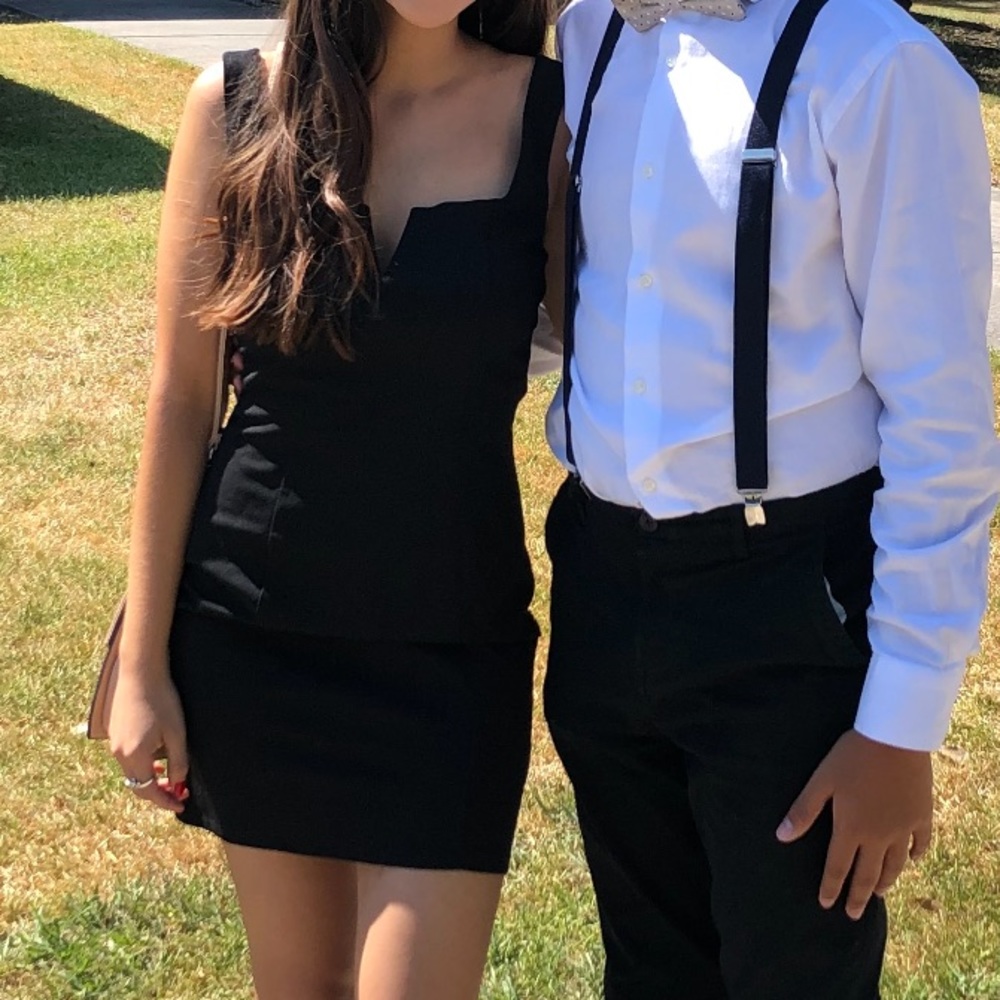 Super cute black form fitting mini dress.